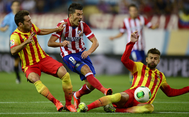 David Villa (középen) pazar góllal nyitotta a meccset - fotó: AFP