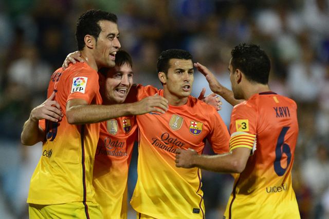 Sergio Busquets, Lionel Messi, Pedro Rodriguez és Xavi, a Barcelona játékosai a Getafe elleni idegenbeli győzelem alkalmával