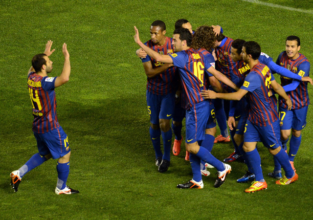 A Barcelona játékosai örülnek a Rayo Vallecano ellen szerzett góljuknak a Primera Divisiónban 2012-ben.