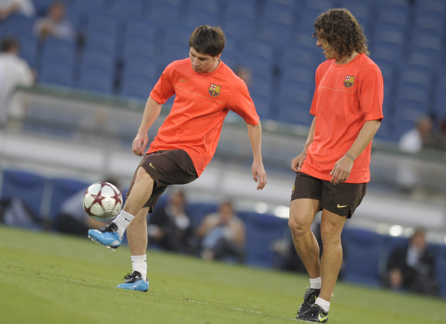 Messi és Puyol - Fotó: AFP