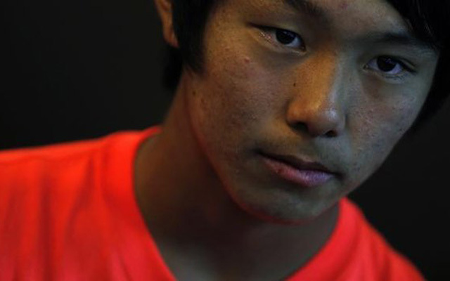 Lehet, hogy hamarosan nagy játékos lesz a pattanásos koreai tini - Fotó: AFP
