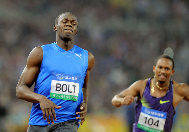 usain Bolt (jobbra) és Michael Frater