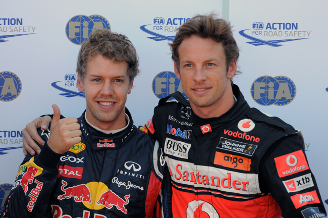 Sebastian Vettel és Lewis Jenson button a Monacói Nagydíj időmérő edzése után.